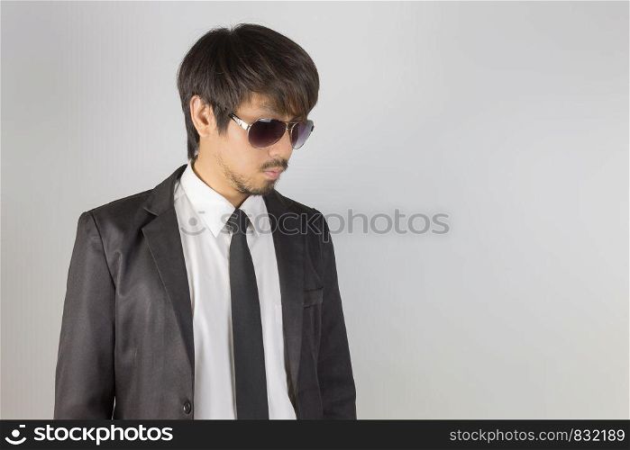Portrait Businessman in Black Suit and Black Eyeglasses Left Frame. Portrait businessman wear white shirt and suit in smart pose style