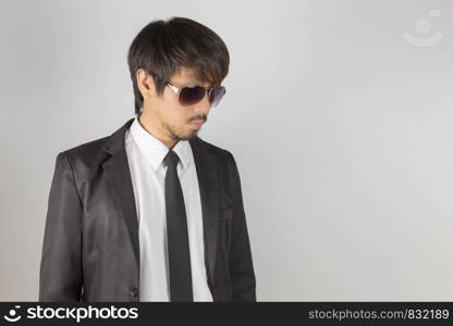 Portrait Businessman in Black Suit and Black Eyeglasses Left Frame. Portrait businessman wear white shirt and suit in smart pose style