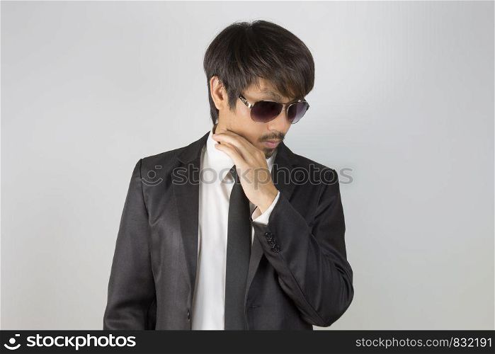 Portrait Businessman in Black Suit and Black Eyeglasses or Eyewear. Portrait businessman wear white shirt and suit in smart pose style