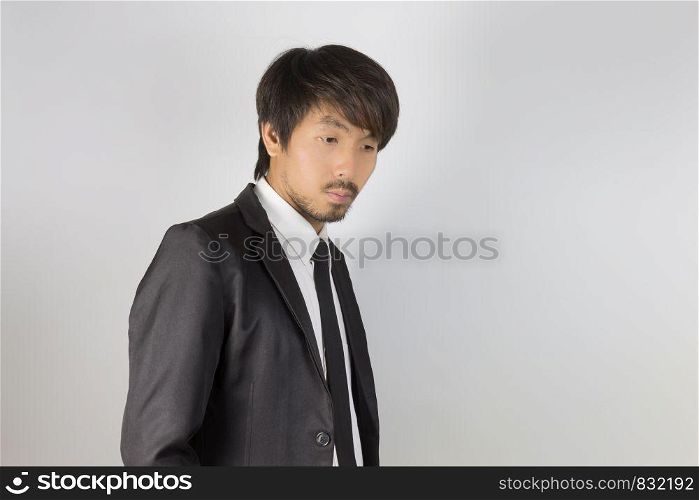 Portrait Businessman in Black Suit Fashion in Side View. Portrait businessman wear white shirt and suit in smart pose style