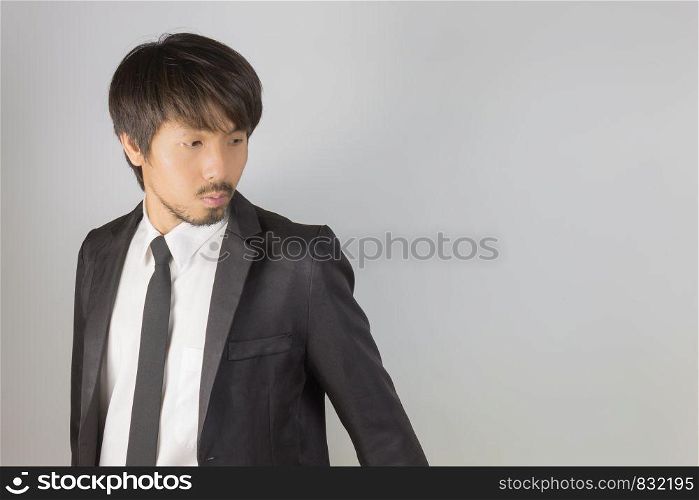 Portrait Businessman in Black Suit Fashion Turn Back Pose. Portrait businessman wear white shirt and suit in smart pose style