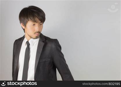 Portrait Businessman in Black Suit Fashion Turn Back Pose. Portrait businessman wear white shirt and suit in smart pose style