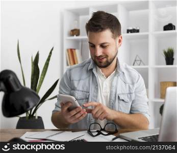 portrait casual male browsing mobile phone