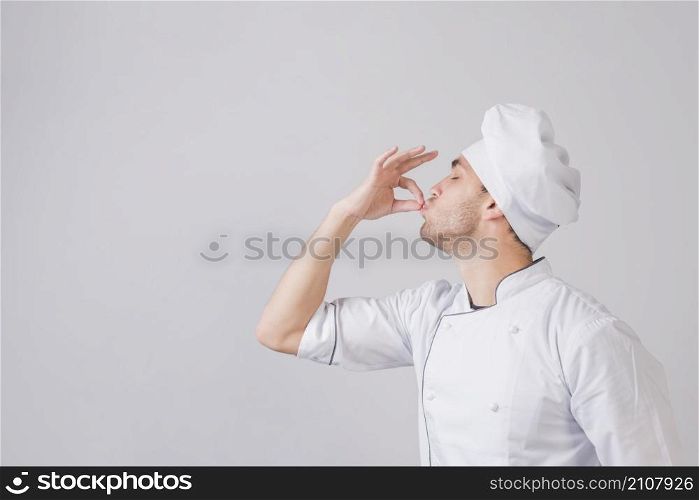 portrait chef doing tasty gesture
