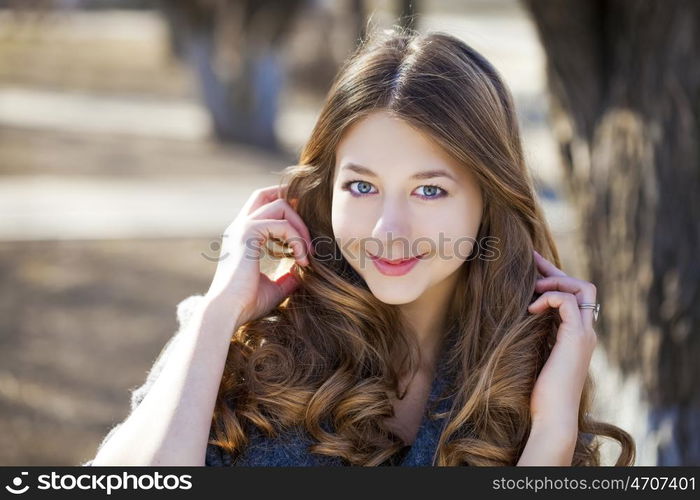 Portrait close up of young beautiful girl, on background spring street