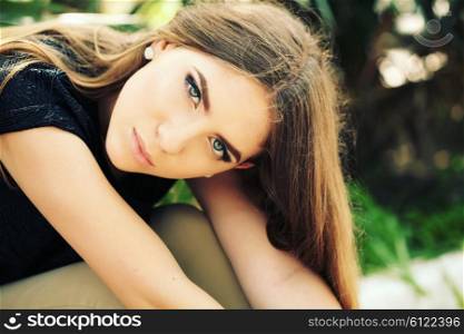 Portrait close up of young beautiful woman, on green background summer nature. Beautiful girl with ombre hair and clean face