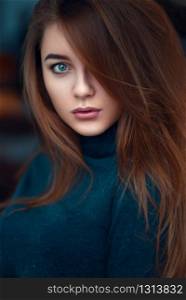 Portrait close up of young glamour woman with long beautiful hair on blur background.