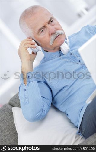 portrait closeup on a man at phone