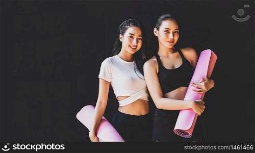 Portrait Couple sporty asian woman standing and smiling, wearing sportswear bra and pants fashion, posture position, sport club community, sports and healthcare concept