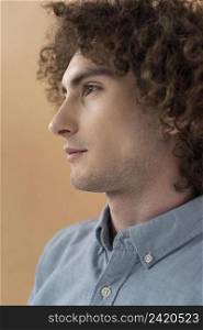 portrait curly haired young man