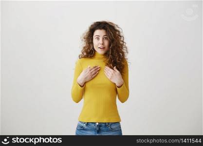 Portrait excited screaming young woman standing isolated over white background. Looking camera. Portrait excited screaming young woman standing isolated over white background. Looking camera.