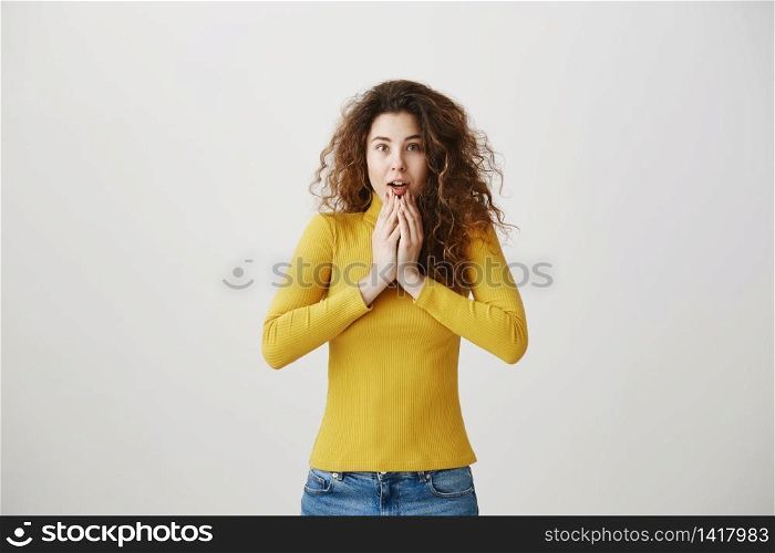 Portrait excited surprise young woman standing isolated over white background. Looking camera. Portrait excited surprise young woman standing isolated over white background. Looking camera.
