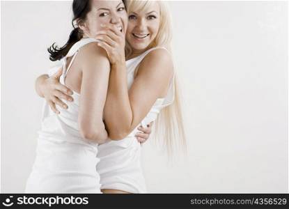 Portrait female homosexual couple embracing each other and smiling