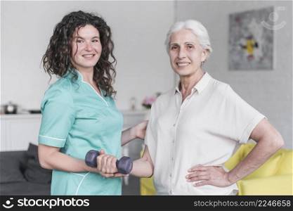 portrait female physiotherapist senior woman patient exercising