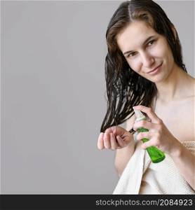 portrait female using hair oil