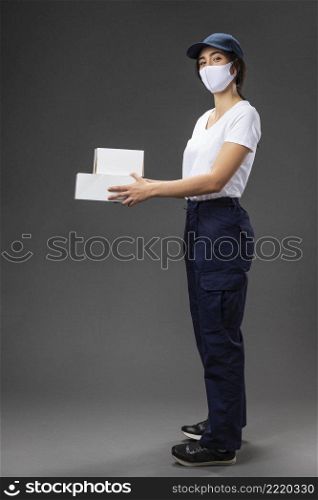 portrait female working delivery service wearing mask