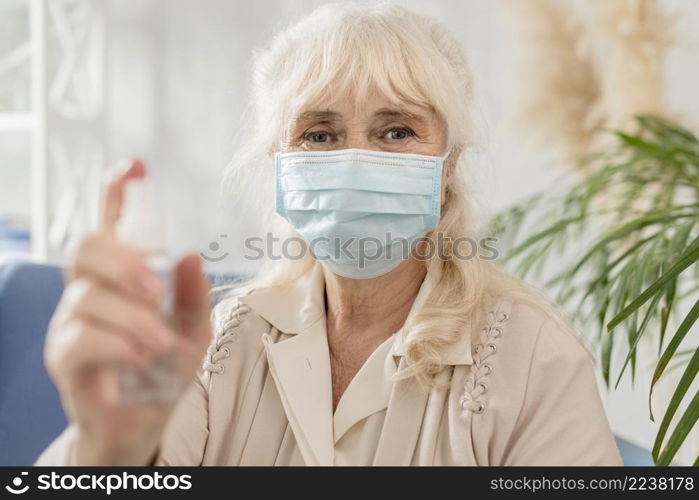 portrait grandma with mask sanitizer