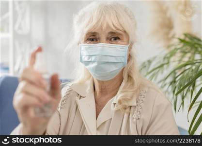 portrait grandma with mask sanitizer