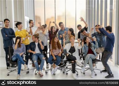 Portrait Group Of Asian and Multiethnic Business people with casual suit in happy action when project is completed in the modern workplace, people business group concept
