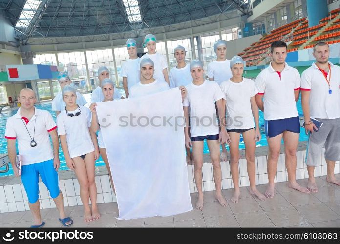 portrait group of happy kids children at swimming pool school with empty white flag