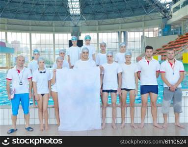 portrait group of happy kids children at swimming pool school with empty white flag