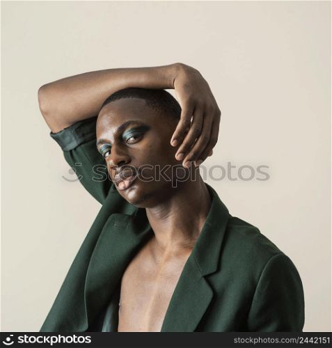 portrait handsome man posing blazer wearing make up 2