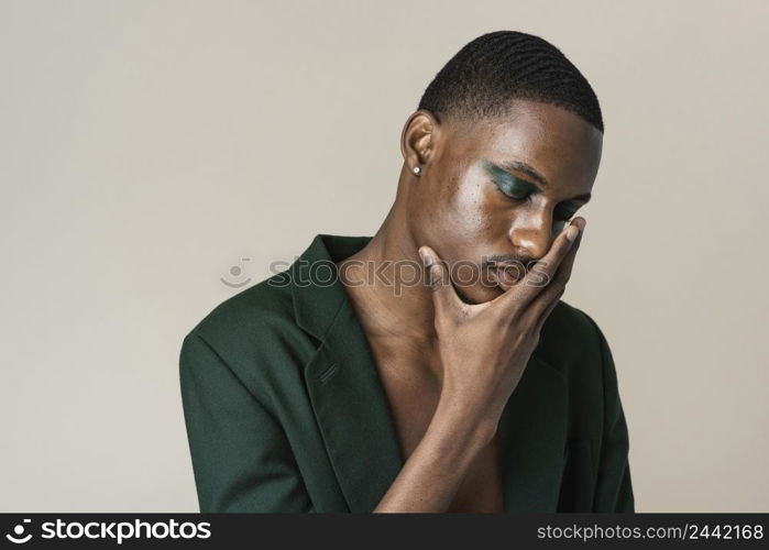 portrait handsome man posing blazer wearing make up