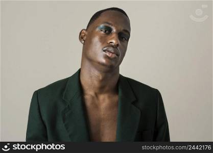 portrait handsome man posing blazer wearing make up 5