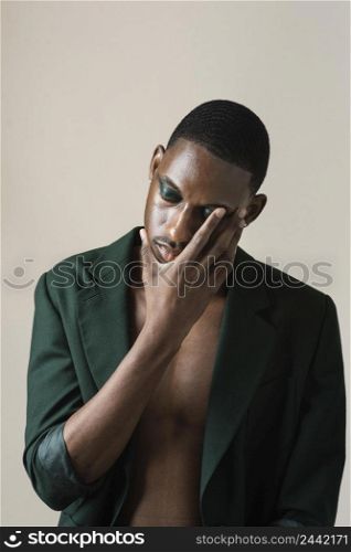 portrait handsome man posing blazer wearing make up 6