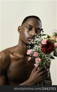 portrait handsome man posing with bouquet flowers 2