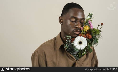 portrait handsome man posing with bouquet flowers 3