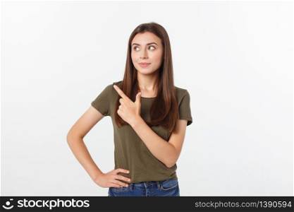 Portrait happy and surprised young lady standing isolated over grey background. Looking camera pointing. Portrait happy and surprised young lady standing isolated over grey background. Looking camera pointing.