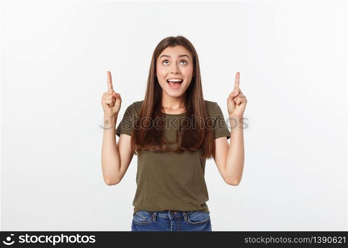 Portrait happy and surprised young lady standing isolated over grey background. Looking camera pointing. Portrait happy and surprised young lady standing isolated over grey background. Looking camera pointing.