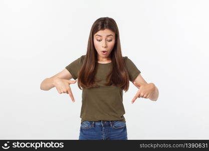 Portrait happy and surprised young lady standing isolated over grey background. Looking camera pointing. Portrait happy and surprised young lady standing isolated over grey background. Looking camera pointing.