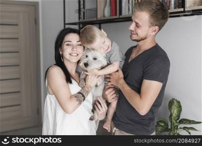 portrait happy family with their dog