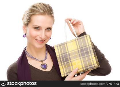 Portrait happy fashion woman in designer clothes with shopping bag
