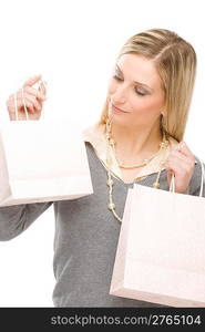 Portrait happy fashion woman in designer clothes with shopping bag