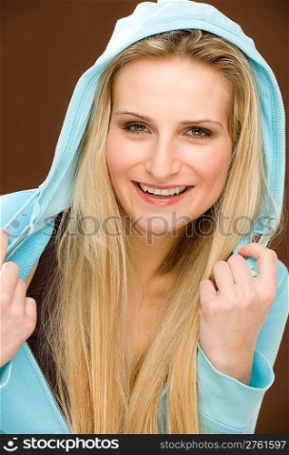 Portrait happy fashion woman wear hood on brown background