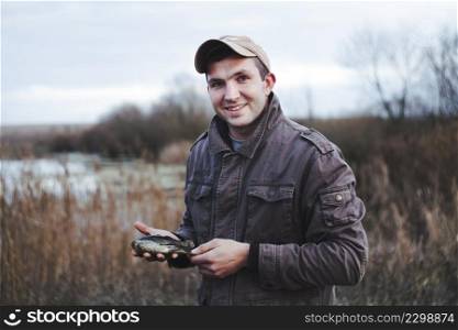 portrait happy fisherman holding fish