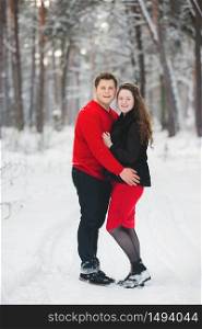 Portrait happy loving couple outdoors hugging, standing in winter forest park. Emotions of happiness. Concept of friendly family holiday. full length. Close Up. Love in Valentine&rsquo;s Day