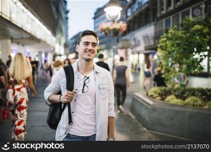 portrait happy man standing sidewalk