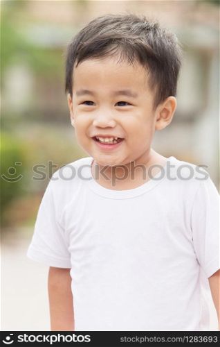 portrait head shot of asian children toothy smiling face happiness emotion