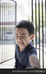 portrait headshot of asian children toothy smiling face happiness emotion
