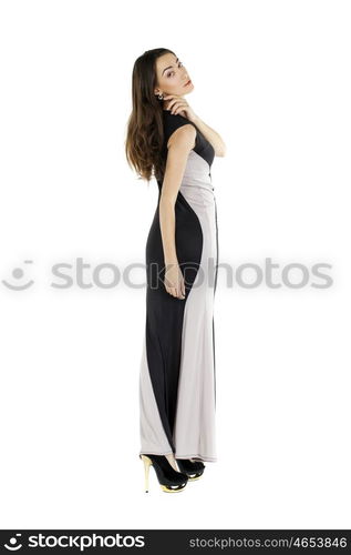 Portrait in full growth of a young woman in long evening dress, isolated on white