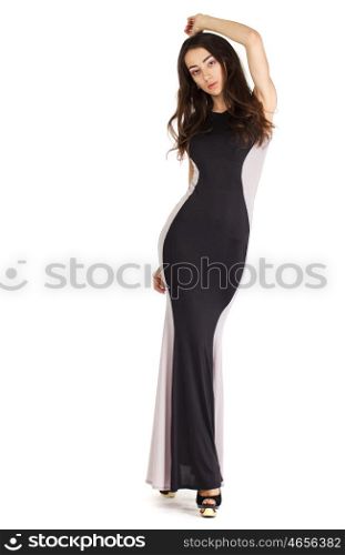 Portrait in full growth of a young woman in long evening dress, isolated on white