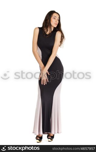 Portrait in full growth of a young woman in long evening dress, isolated on white