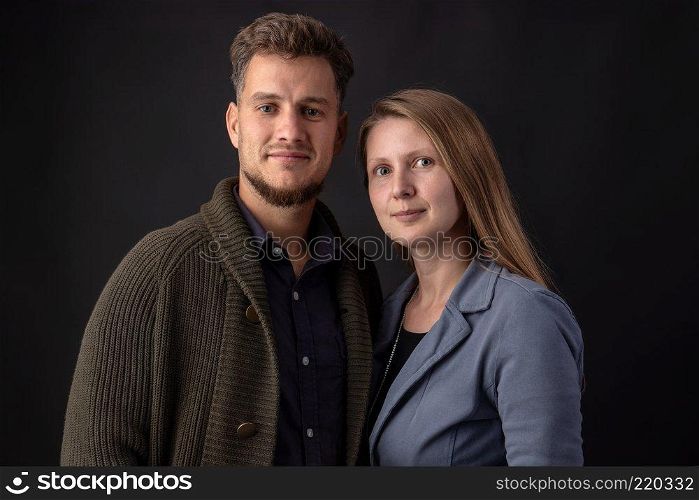 Portrait in the studio of two young business partners standing face to face