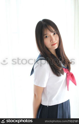 Portrait japanese school girl in white tone bed room