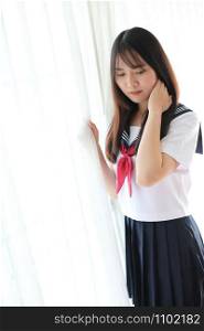 Portrait japanese school girl in white tone bed room