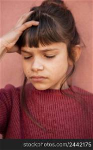 portrait little girl having headache